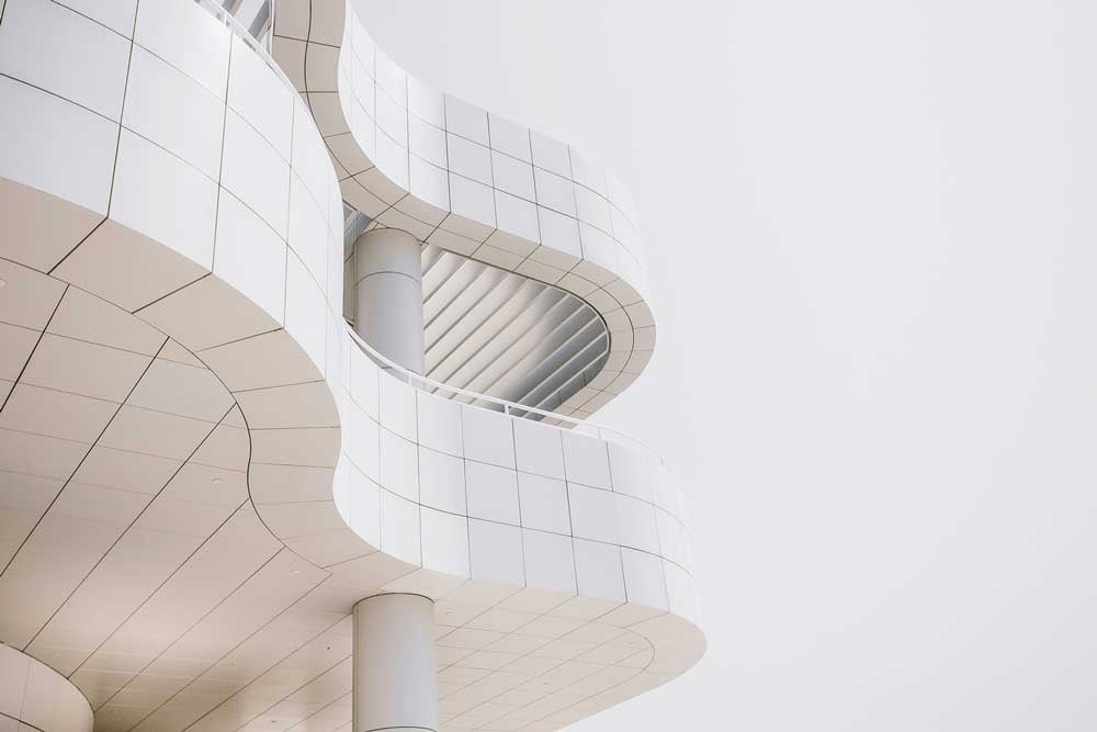 A modern architectural structure with a sleek, curved design.